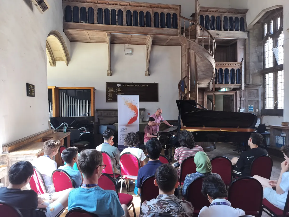 A masterclass in the historic Quilter Hall, with students watching