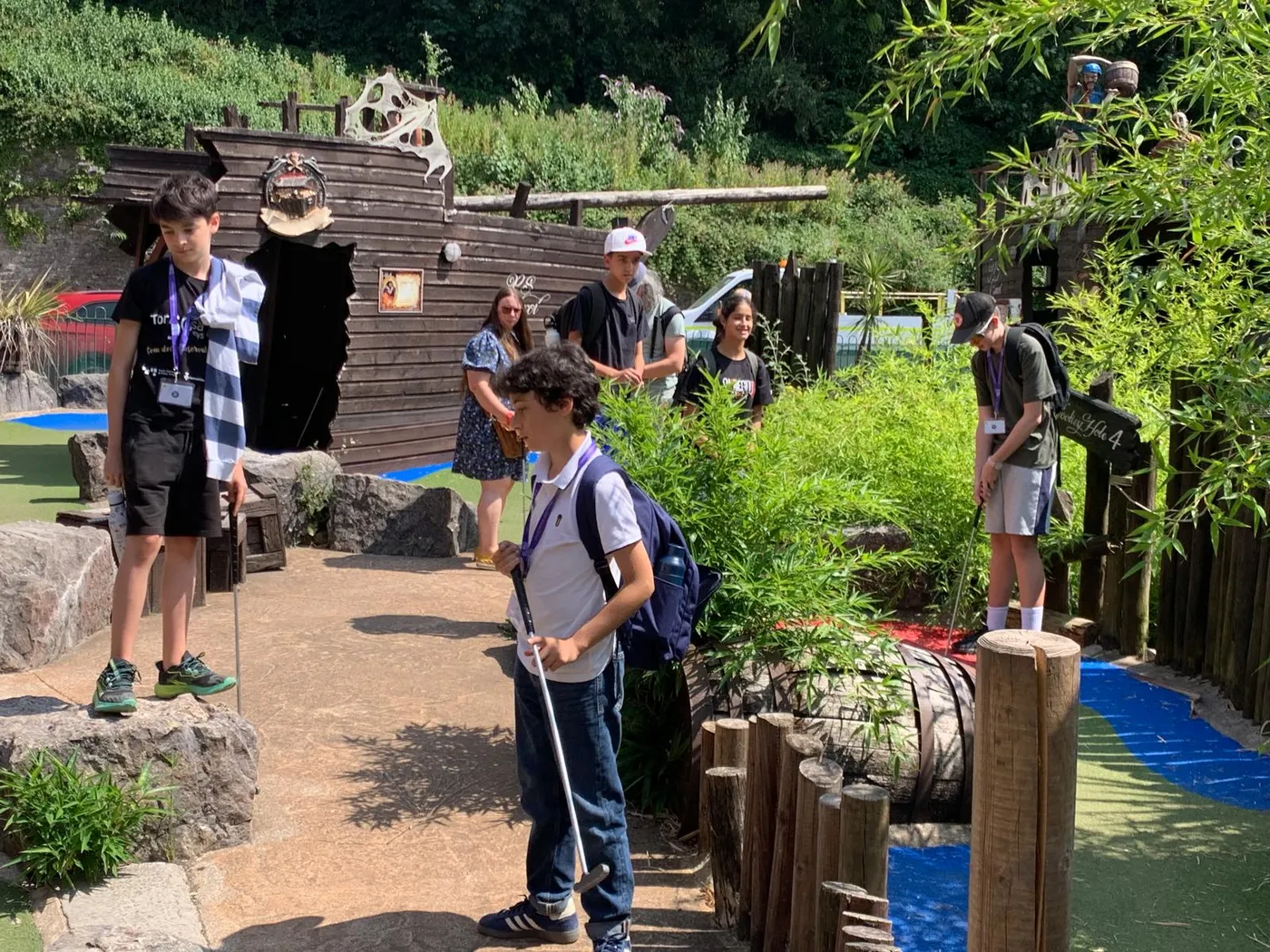 Students playing adventure golf together during free time
