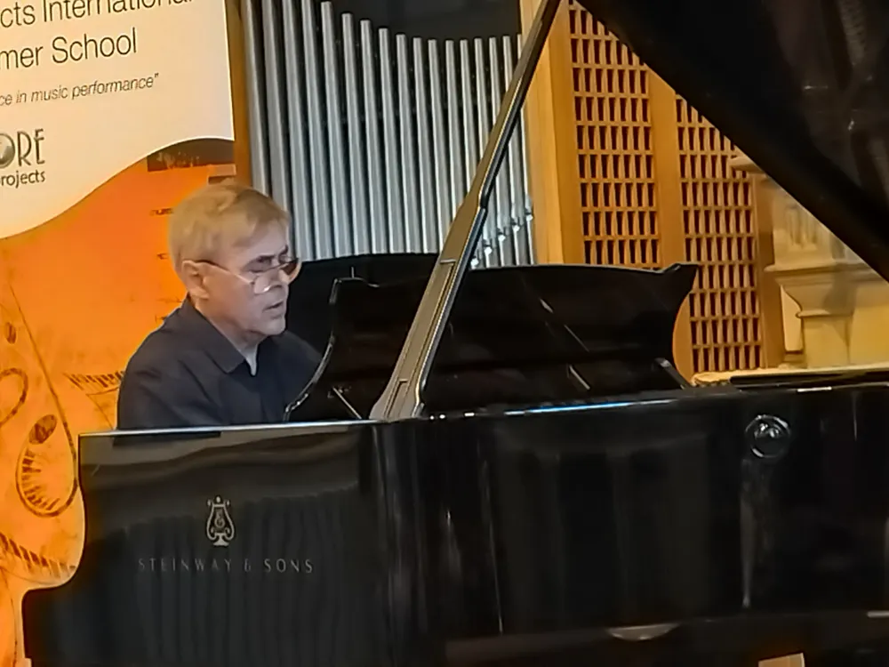 A faculty pianist performing a solo recital
